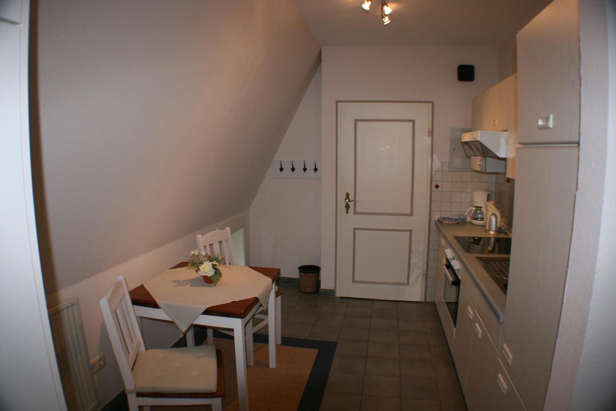 Ferienwohnungen Im Hotel Garni Zur Post Utersum Habitación foto